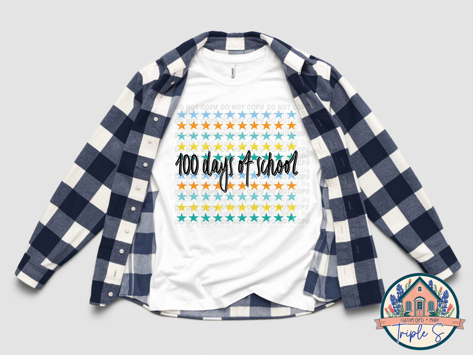 White t-shirt with '100 days of school' design under a blue and white checkered shirt on a light gray background.